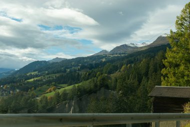 Arosa area , Switzerland, October 12, 2024 Colorful scenery on the road in autumn clipart