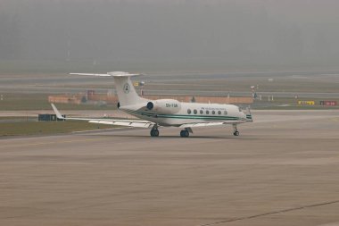 Zurich, Switzerland, January 20, 2025 5N-FGW Nigerian Air Force Gulfstream G550 aircraft is taxiing on a very foggy day during the world economic forum in Davos clipart