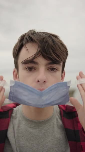 Closeup Portrait Teenager Boy Putting Protective Face Mask Coronavirus Pandemic — Stock Video