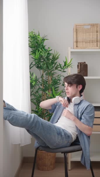 Relaxed Teenager Boy Sending Voice Message Smart Watch Home Window — Video