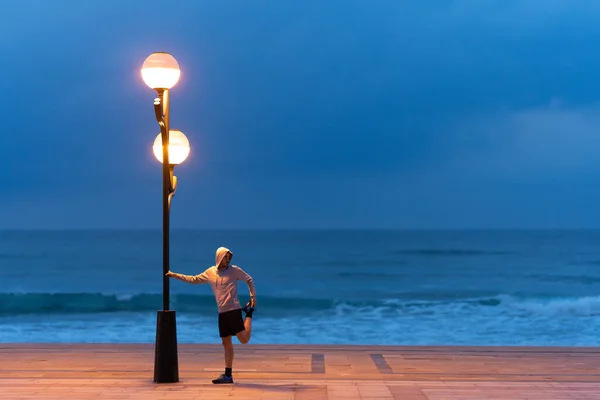 Male Athlete Stretching Streetlight Night Sport Motivation Concept Man Working — Stock Photo, Image