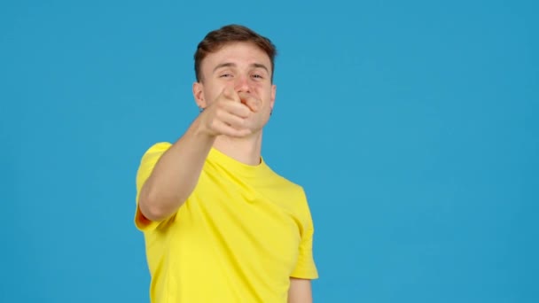 Young Positive Man Doing Heart Love Shape Hands Isolated Blue — Stock Video