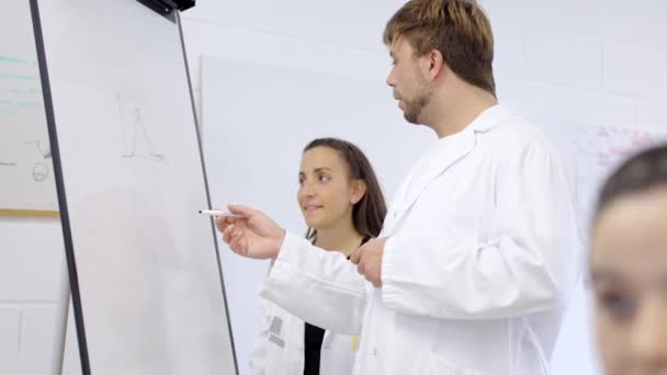 Young Scientist Coworkers Looking Writing Whiteboard Teamwork Concept — Stock Video