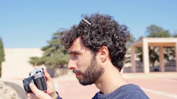 Young Hispanic Man Taking Photograph Vintage Analog Camera Tourist Looking — Stock Video