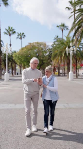Senior Tourist Couple Using Gps Phone While Walking — Stock Video
