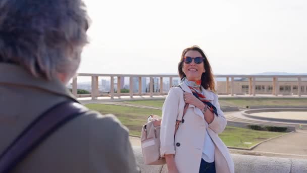 Senior Tourist Woman Posing While Husband Directing Her Taking Photo — Stock Video