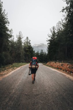 Man hiker with backpack on Lycian trail in Turkey