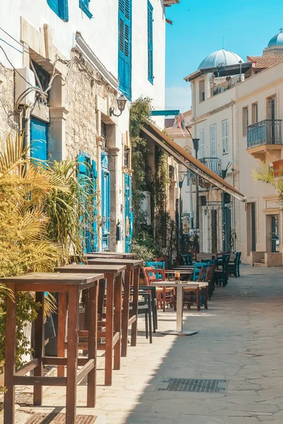 Streets of the old city of Limassol. Blue shutters on the colonial architecture of Cyprus.