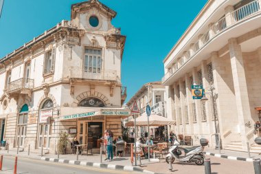 Streets of the old city of Limassol. Blue shutters on the colonial architecture