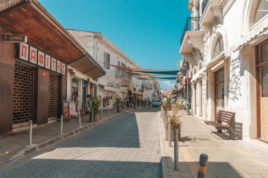Streets of the old city of Limassol. Blue shutters on the colonial architecture