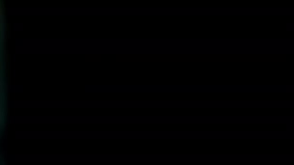 Abstrakcyjny Cyjan Bokeh Poruszający Się Chaotycznie Lewej Stronie Ramki Bokeh — Wideo stockowe
