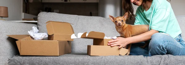 Banner pet owner and little dog unboxing online purchase, internet pet shop concept.