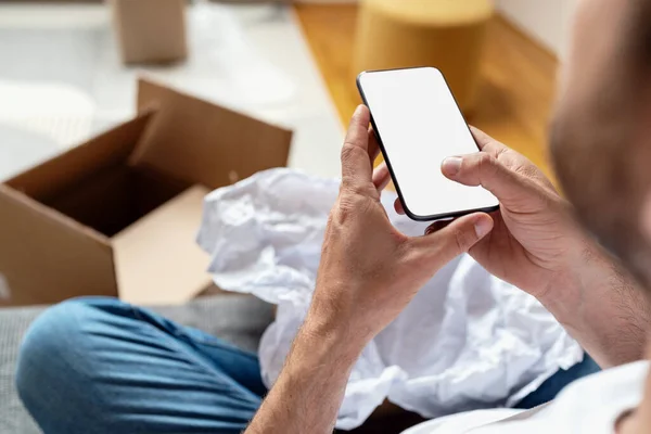 stock image Mobile phone with blank screen in male hands, mobile app of delivery service, online shopping, service of consumers feedback.