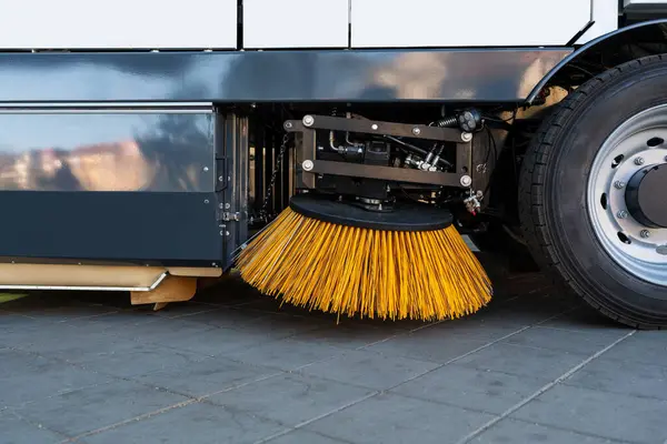 Street sweeper brush close-up. Cleaning city street.