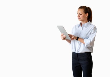 Isolated businesswoman wearing formal outfit using digital tablet.