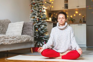 Christmas harmony. Xmas lifestyle. Woman meditating during Christmas holidays, clipart