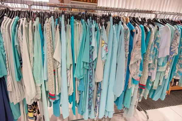stock image blue and white summer blouses on a hanger in the store, bright summer clothes, High quality photo