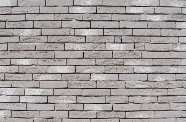 Gri desenli tuğla duvar, uzun ve dar modern tuğlalar, yatay dekoratif duvarlar, desenli taş zemin, yeni binanın dışındaki tuğla işçiliği.,