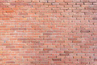 Büyük yıpranmış kırmızı tuğla duvar, kaba bir görünüme sahip mimari görseller için dokulu bir zemin oluşturuyor, eski bina duvarı.,