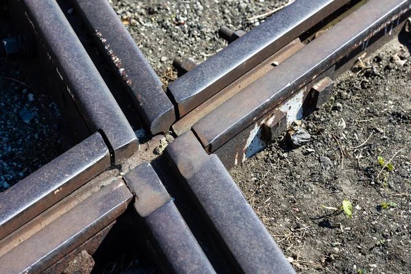 Close up for junction of railway rails on the tracks. Photo taken during the day with good lighting