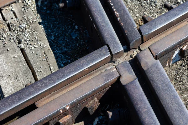 Close up for junction of railway rails on the tracks. Photo taken during the day with good lighting