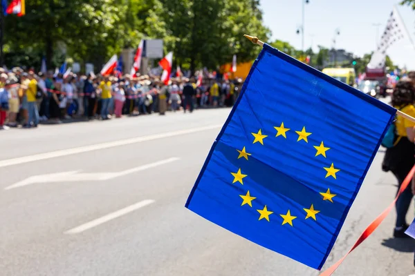 The flag of the European Union on a protest march. A manifestation of sympathy for the European Union. Photo taken on a sunny day.