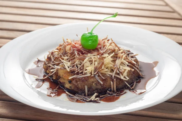 Banana Bakar Cheese is made from grilled bananas and covered with chocolate and grated cheese