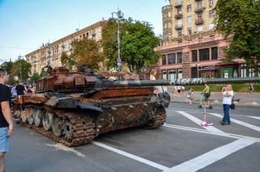 People visit an exhibition of destroyed Russian military vehicles and weapons in Kyiv