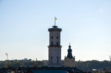 Panoramic view of historic city center of Lviv with Tower of town Hall and Latin Cathedral at sunny autumn day