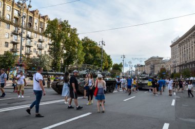 People visit an exhibition of destroyed Russian military vehicles and weapons in Kyiv