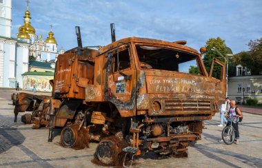 People visit an exhibition of destroyed Russian military vehicles and weapons in Kyiv