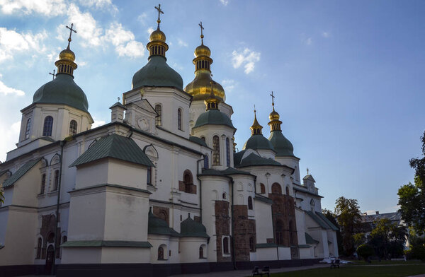 Architectural landmark of the famous medieval St Sophia Cathedral with green and golden domes, in the center of Kyiv, Ukraine