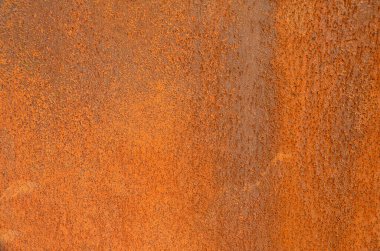 Paslı metal yüzey dokusu, düzensiz desenli, koyu kahverengiden sıcak turuncu renge kadar değişen gölgeler. Madde bozulması ya da özgün arkaplan
