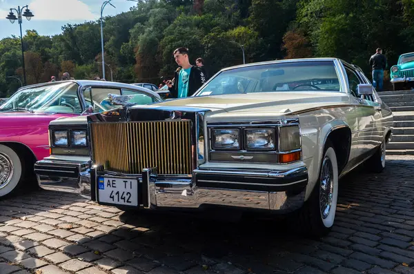 stock image American luxury vintage car white sedan Cadillac DeVille 1990 presented at exhibition of retro cars in Kyiv 