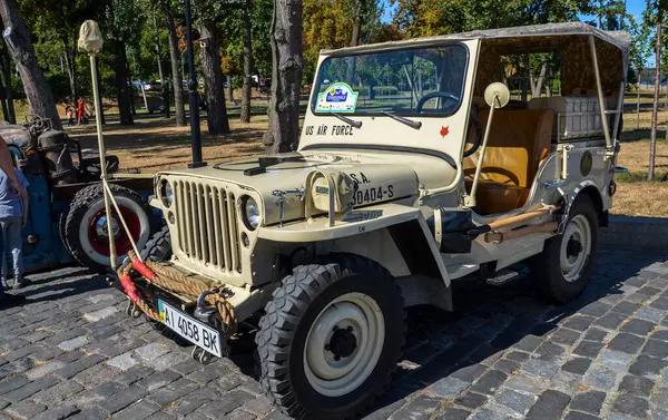 stock image Yellow vintage american army off-road military jeep Willys MB from World War II presented at retro car exhibition in Kyiv