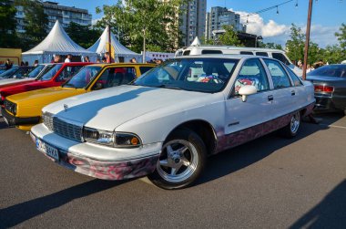 Chevrolet Caprice,1992 white full-size sedan synonymous with American luxury and comfort, represents a bygone era of automotive grandeur  clipart