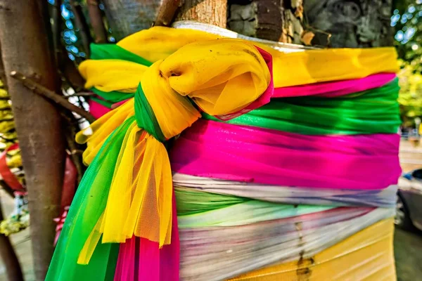 Colorful fabric wrapped around the tree, cloth wrapped around holy tree, Thailand\'s faith