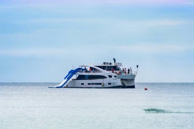 Rayong, Thailand - October, 15, 2022 : Passenger boat floating in the sea at the Koh Samet island, Rayong, Thailand