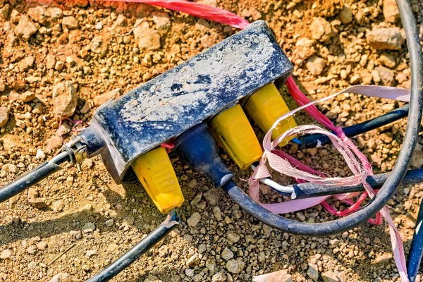 Power plug in construction site on the ground