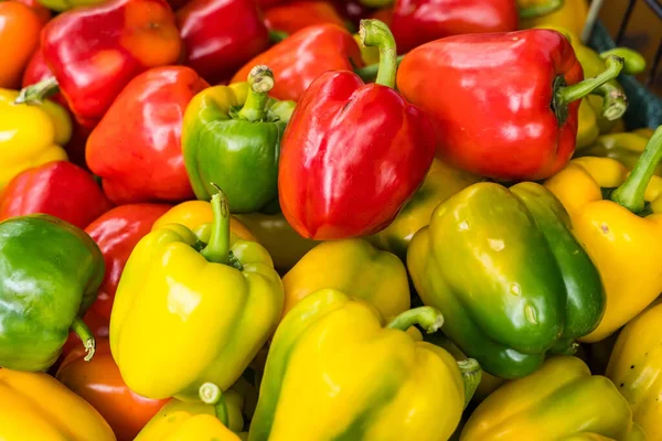 Red bell peppers, green bell peppers and yellow bell peppers