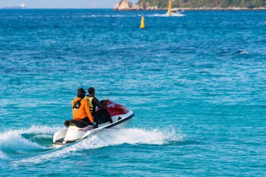 Chonburi, Thailand - February, 03, 2023 : Experience the thrill of jet skiing with this action-packed image of two riders navigating the waves at Chonburi, Thailand. clipart