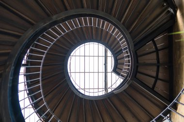 Chonburi, Thailand - May, 26, 2024 : Journey to the Light: The Spiral Staircase at Chonburi, Thailand. clipart