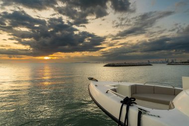 Chonburi, Thailand - May, 27, 2024 : Evening Elegance: Yacht in Sunset Glow at Chonburi, Thailand clipart