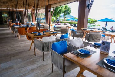 Chonburi, Thailand - May, 27, 2024 : Elegant Open-Air Restaurant Overlooking the Beach and Ocean at Chonburi, Thailand clipart