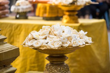 Sandalwood flowers are used in Thai funeral rituals as a sign of mourning and farewell to the deceased. clipart