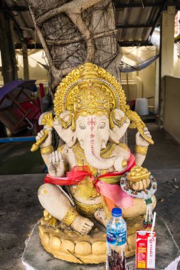 Ayutthaya, Thailand - April, 26, 2024 : Serene Ganesha Idol with Traditional Offerings at Ayutthaya, Thailand. clipart