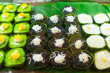 An enticing display of traditional Thai desserts in a local market, capturing the beauty of Thai sweet treats. clipart