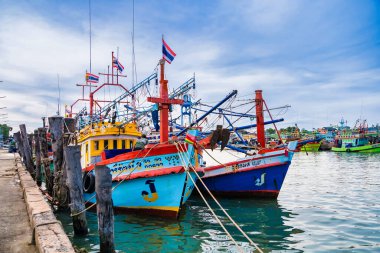 Chonburi, Thailand - November, 18, 2024 : Colorful Fishing Boats Docked at a Bustling Harbor in Thailand, Showcasing Traditional Maritime Culture and Vibrant Coastal Life at Chonburi, Thailand. clipart