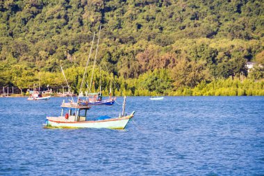 Chonburi, Thailand - November, 18, 2024 : Rustic Fishing Vessel in Tranquil Sea at Chonburi, Thailand. clipart