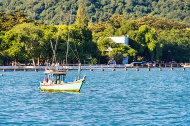 Chonburi, Thailand - November, 18, 2024 : Rustic Fishing Vessel in Tranquil Sea at Chonburi, Thailand. clipart